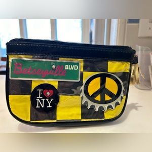 Betsey Johnson NYC yellow zipper pouch in good condition